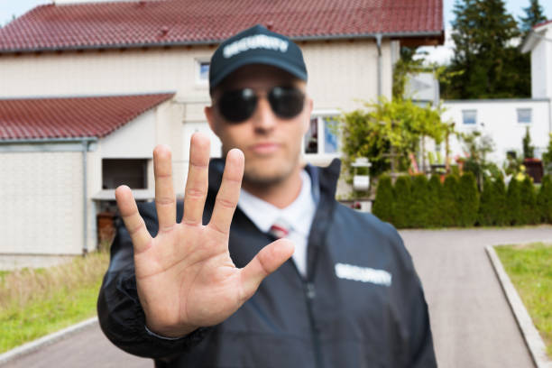 Male Security Guard Making Stop Sign With Hands