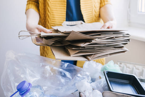 Woman holding different type of paper bags. Earth day concept